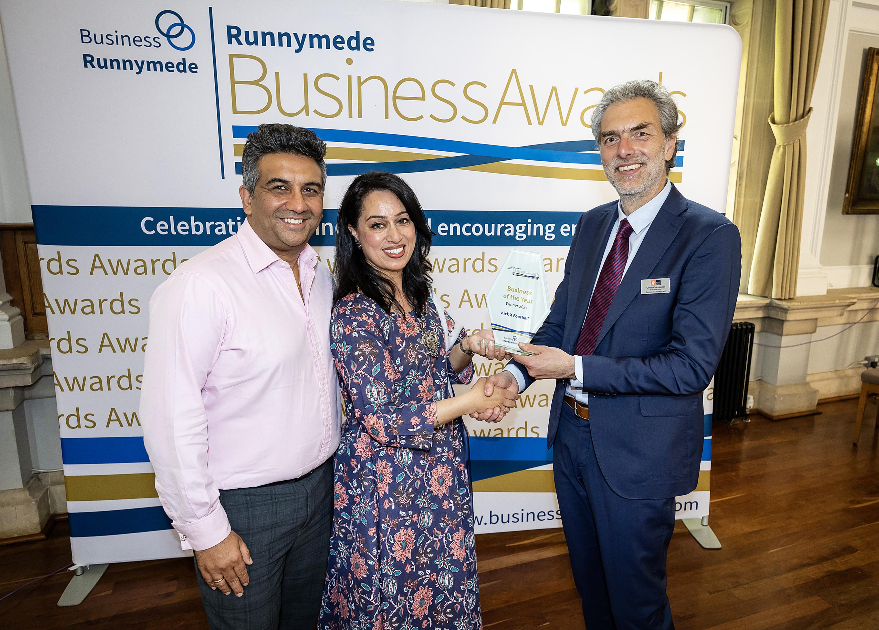 The KickX team receive the Business of the Year award from Royal Holloway's Christos Tsinopoulos.